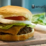 hamburger airfryer with cheese, tomato, onion, and lettuce