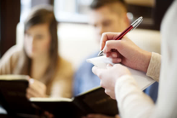 couple-ordering-a-dinner-at-restaurant